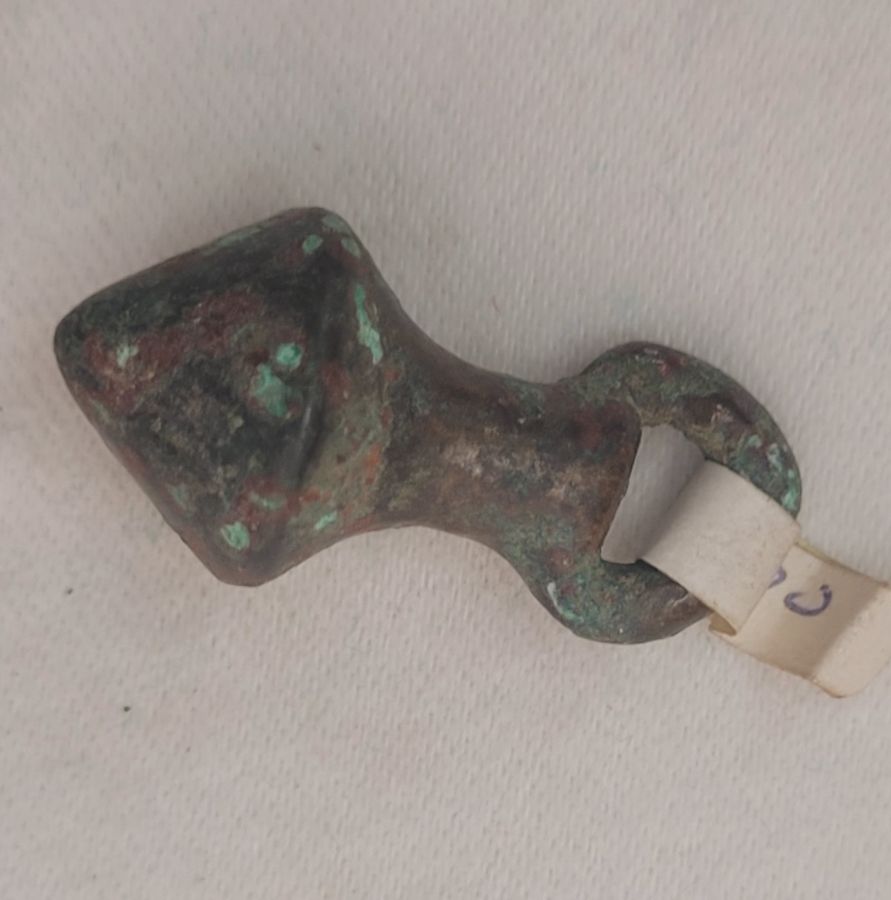 Genuine antique small bronze balance weight builder's utensil found in the holy land and dated 2000 BC. Dimension diameter 1.6 cm X 3 cm approximately.