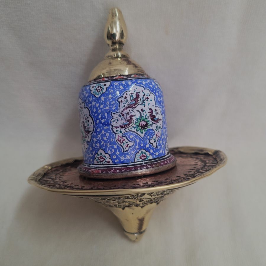 A combined handmade wood base and brass blue enameled Hanukah Dreidel hand painted floral & birds designs diameter 9 cm X 10 cm.