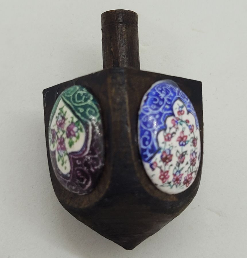 Handmade Hanukah mini Dreidel oval shape enameled with floral and birds designs on wood Dreidel. Made by S. Ghatan ( Katan).