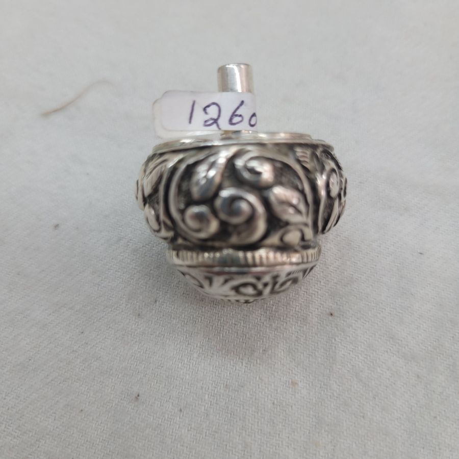 Sterling silver Hanukah Sevivon Dreidel floral embossed designs & leaf engravings. Made By S. Ghatan ( Katan) , diameter 2.5 cm X 3.5 cm approximately.
