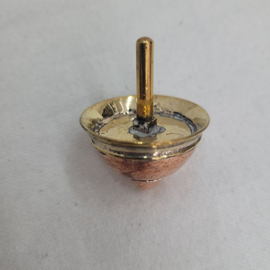 An original and one of a kind Contemporary brass Dreidel Sevivon design made by S. Ghatan Katan from Jerusalem diameter 3.5 cm X 4 cm approximately.