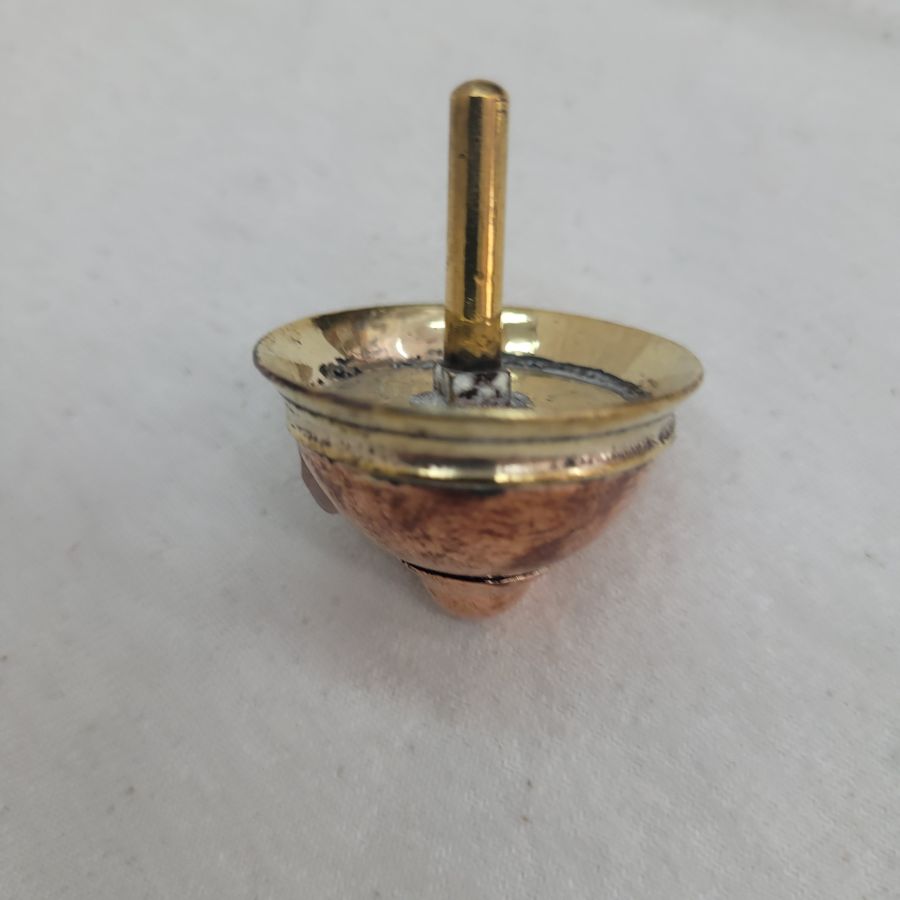 An original and one of a kind Contemporary brass Dreidel Sevivon design made by S. Ghatan Katan from Jerusalem diameter 3.5 cm X 4 cm approximately.