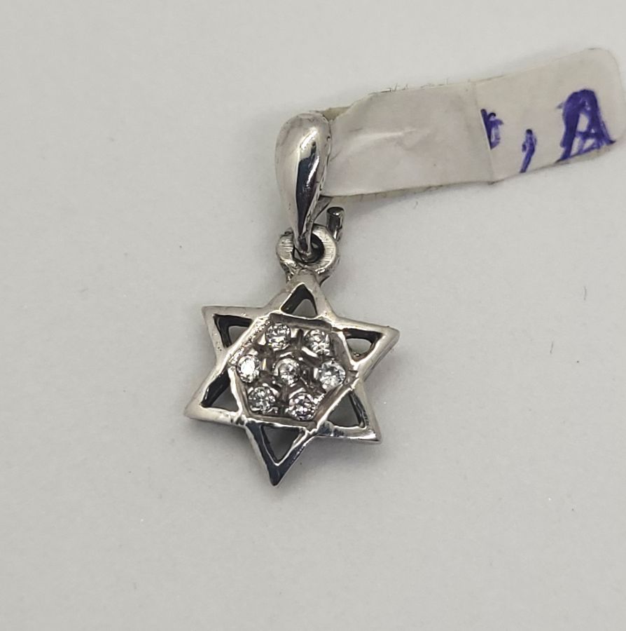 Handmade 14 carat white gold mini David star pendant set with seven Zirconia stones and forming a star of David, 1 cm X 0.2 cm X 2 cm approximately.