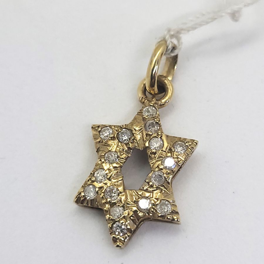 Handmade 14 carat yellow gold elongated Magen David pendant set with 15 Diamonds, clarity VS and total weight 32PTS forming a star of David.
